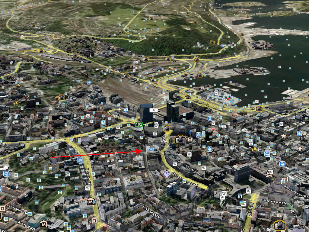 Andre veien mot sydøst. Rød pil er bygningen